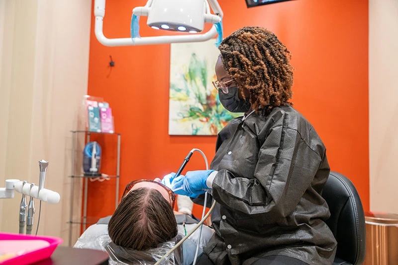 Patient sitting in the exam chair at 10 day smiles in Arlington TX.