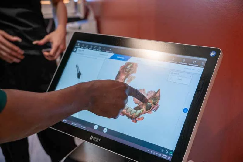 Dr. Abazie reviewing a patients dental X-rays